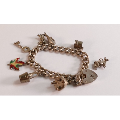 806 - Silver charm bracelet,53.9g.