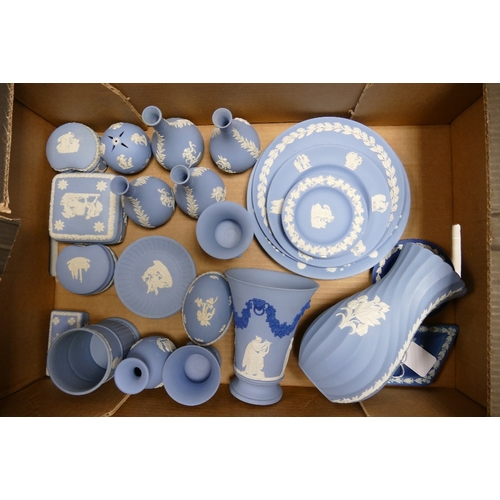 12 - A large collection of Wedgwood Blue Jasperware including vases, pin trays, lidded boxes, wall plates... 