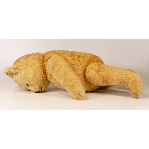 166 - A 20th Century Teddy Bear. Arms and Legs have joints connecting by strings, plastic eyes, three sewn... 