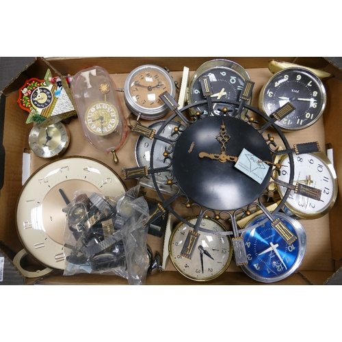 A collection of clocks and watches to include Presta alarm clock ...