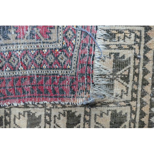 311D - An Eastern Prayer Rug. Wear and fraying noted. Length: 141cm Width: 92cm