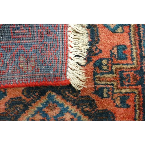 311F - An Eastern Style Five Medallion Pattern Rug in Red and Turquoise Colours. Wear and Fraying Noted. Le... 