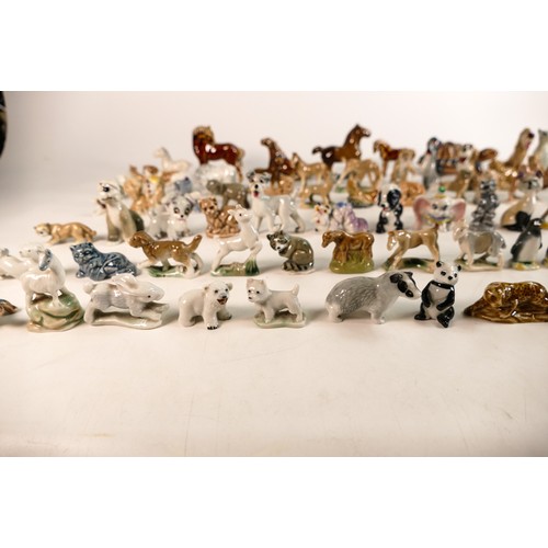 303 - A good collection of Wade Whimsies comprising Disney and first version Whimsies including Merlin as ... 