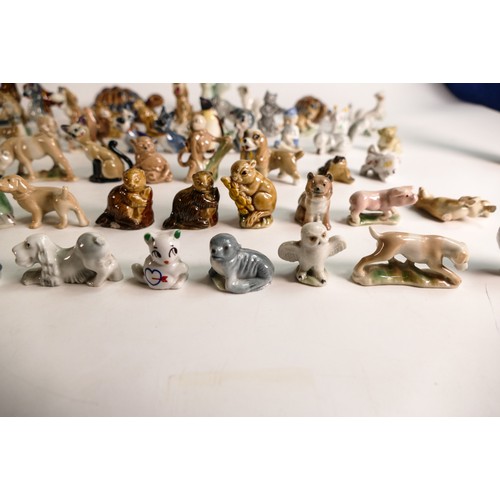 303 - A good collection of Wade Whimsies comprising Disney and first version Whimsies including Merlin as ... 