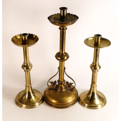 603 - Three non-matching Ecclesiastic candlesticks, one with foliate Brass scrollwork to base. Height of t... 