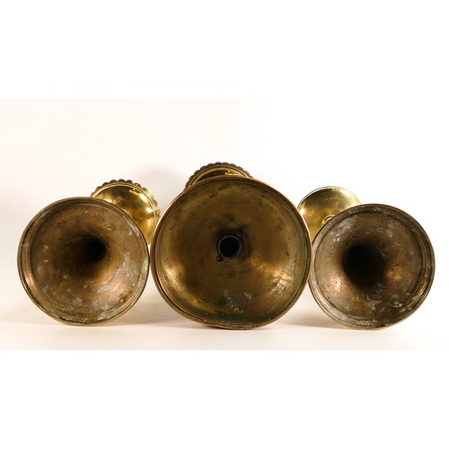 603 - Three non-matching Ecclesiastic candlesticks, one with foliate Brass scrollwork to base. Height of t... 