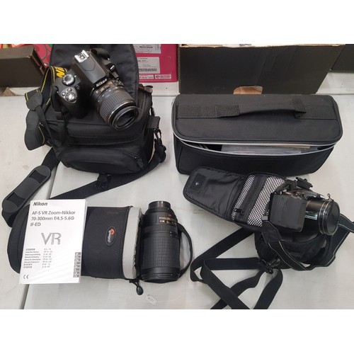 64 - A collection of photographic equipment to include a Nikon D40x camera, Nikon AF-S VR 70 - 300mm lens... 