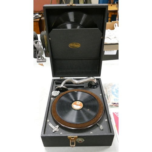 388 - Vintage Triumph portable cased record player with some records.