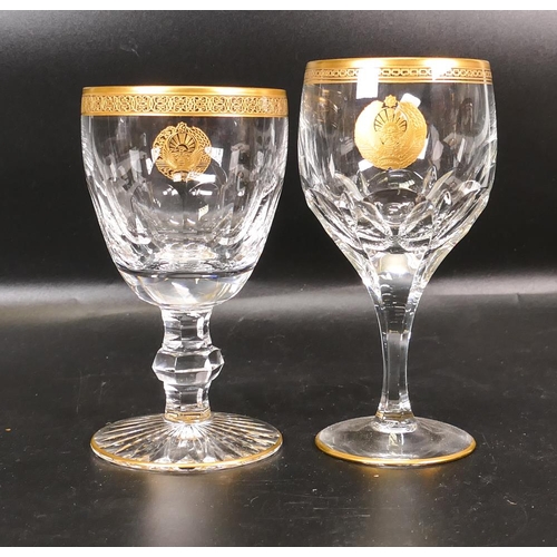 399 - Two De Lamerie Fine Bone China heavily gilded Non Matching Wine Glasses with Star & Crescent Motif, ... 