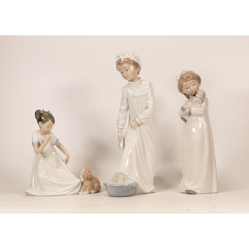 477 - Three Nao Pottery Figures Girl in Pyjamas with Doll, Girl with Puppy 1434 & Girl in nightgown Bathin... 