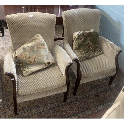 579 - Matching ladies and gents green upholstered armchairs (2).