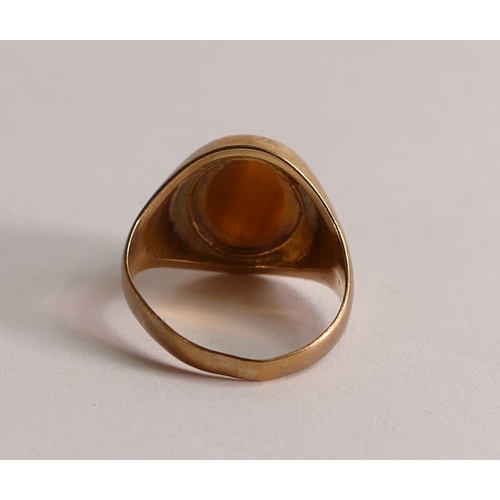 803 - 9ct gold ring set with brown oval stone,size M, 4.2g.