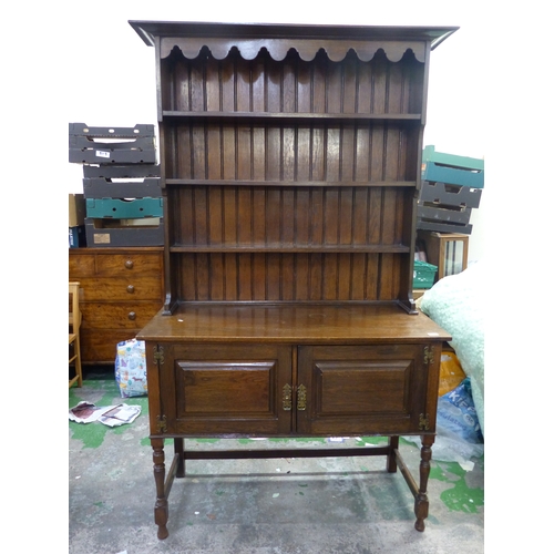 583 - Early 20th dark Oak dresser stretchered two door base with plate rack above 122cm W x 211cm H