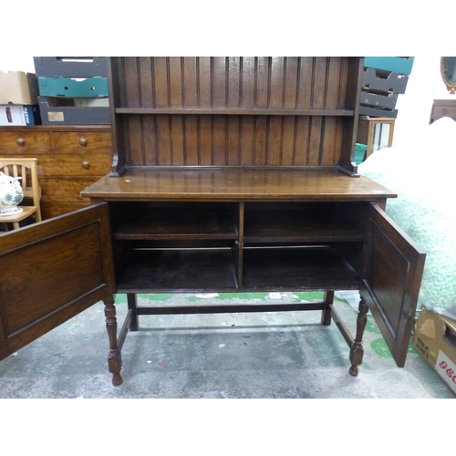 583 - Early 20th dark Oak dresser stretchered two door base with plate rack above 122cm W x 211cm H