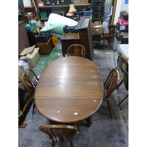 584 - Oval Oak extending dining table together with 4 matching spindle back Windsor dining chairs & two ma... 