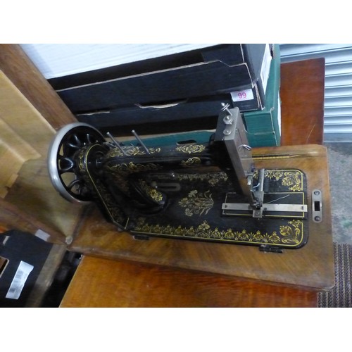 586 - WJ Harris & Co Sewing machine in inlaid wooden case, key present