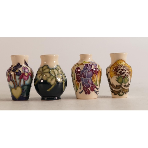 526 - Moorcroft miniature vases to include Flower of the Month, Lucky Clover, Yellow floral (chip to rim, ... 