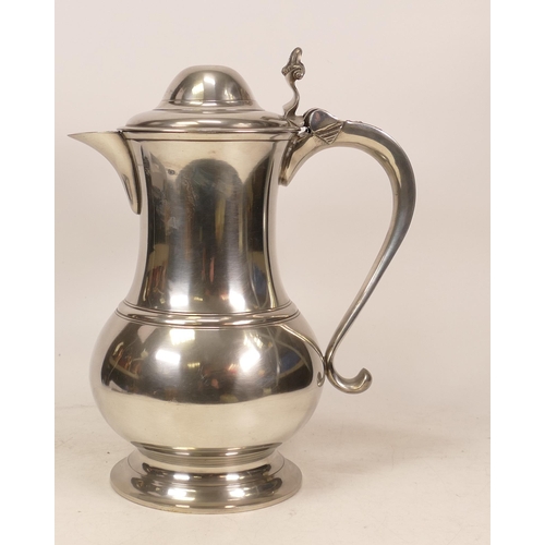 531 - A. E. Williams, A Large Pewter Lidded Jug with Shellform Handle. Height: 30cm