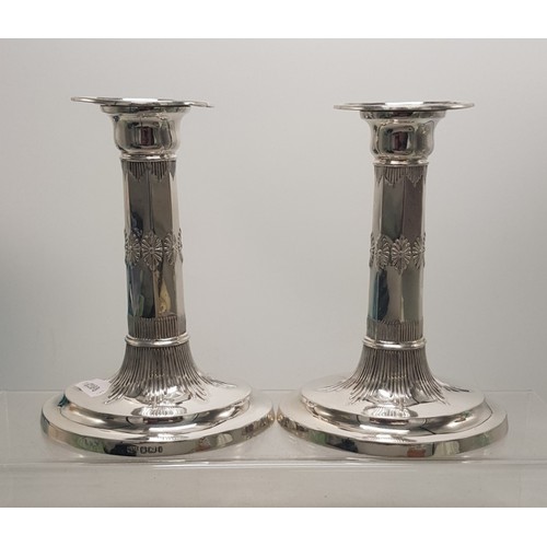 561 - Pair of Sterling silver weighted candle stick holders, Sheffield 1901, total weight 729.5g.