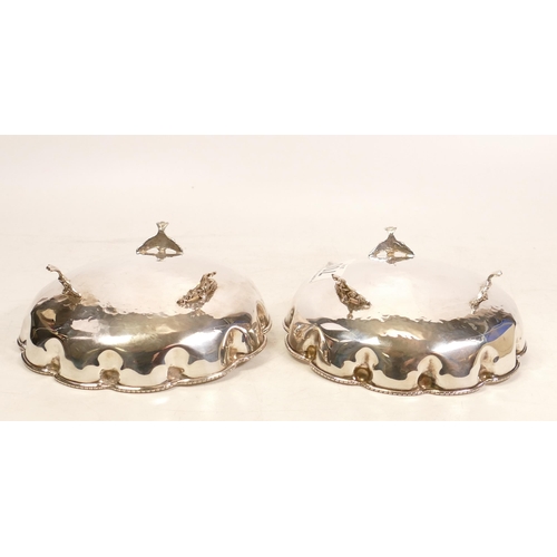 700 - A Pair of Sterling Silver Planished Bonbon Dishes. Each on three feet with a leaf-form handle. Stamp... 