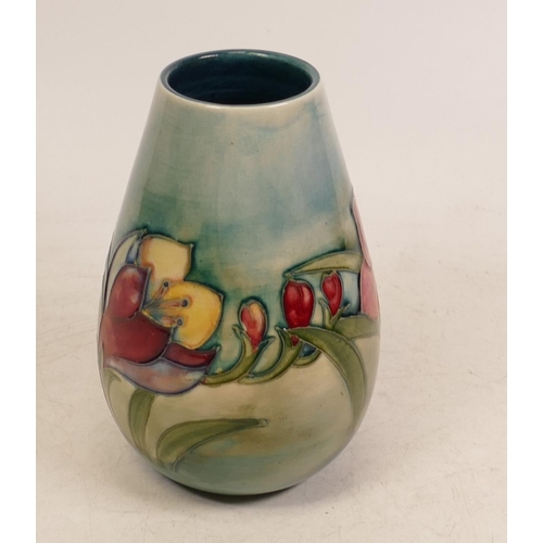 41 - Moorcroft Freesia vase on faded blue ground. Height 13cm