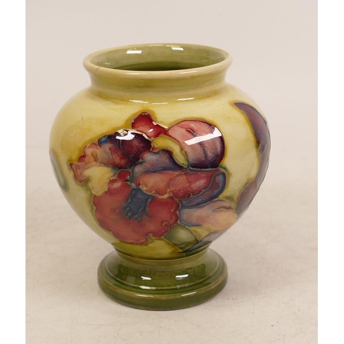 43 - Moorcroft Orchid footed vase on faded yellow/green ground. Height 9cm