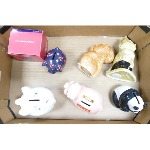25 - A collection of Wade money boxes to include Britannia pig, panda bear, squirrel, cat, floral piggy b... 