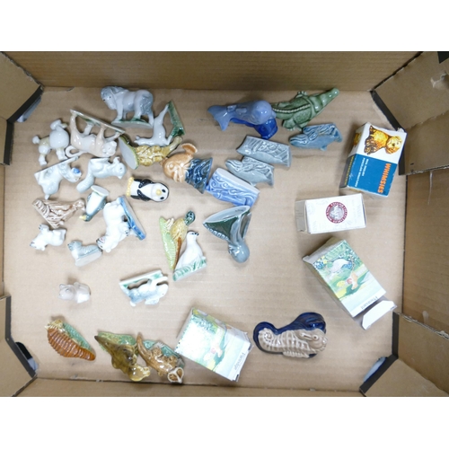 31 - A collection of Wade Whimsies to include dinosaurs, whales, crocodile, octopus, poodle, etc (1 tray)