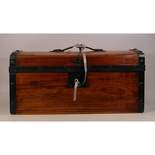 39 - Stained pine wooden chest with key . Length 51cm, depth 23cm