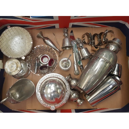 97A - A mixed collection of silver plated and white metal items including napkin rings, cocktail shakers, ... 