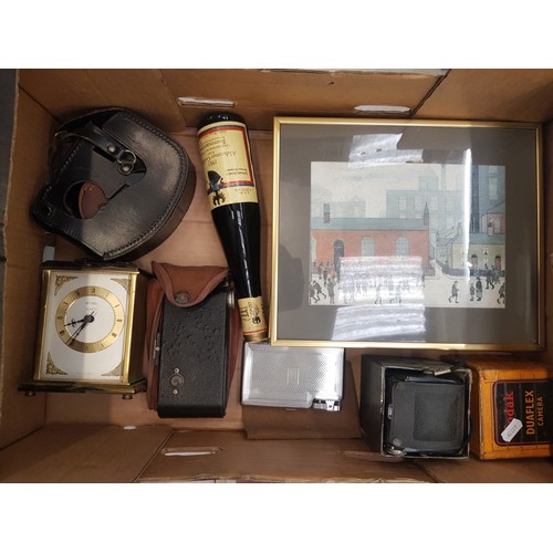 135 - A mixed collection of items to include vintage cameras, Metamec quartz clock, group of 3 small frame... 