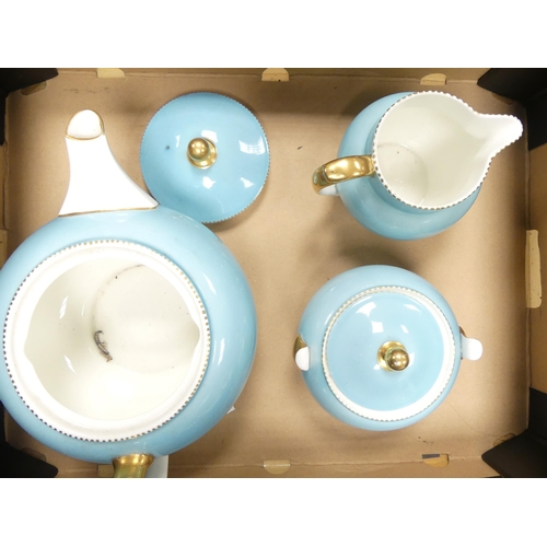 105 - Wedgwood blue and gilt teapot, milk jug and sugar bowl (3)