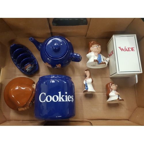 303 - A collection of Wade Tetley Tea folk items to include Tea pot, Cookie jar, toast rack, milk jug & sa... 