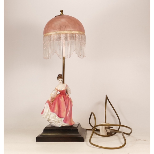 485 - Royal Doulton lady figure with pink dress and bonnet on wooden base and pink shade