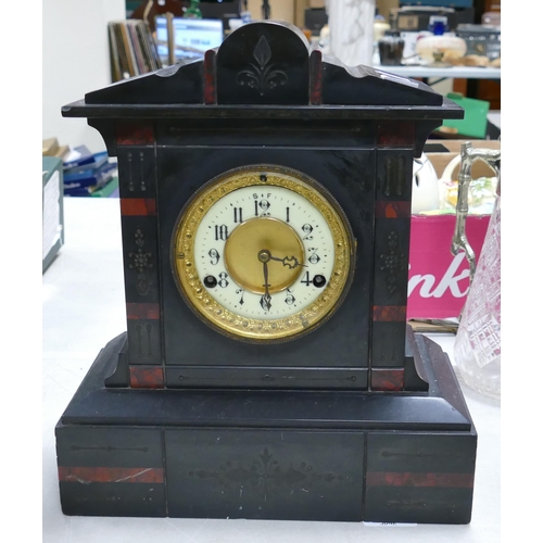 499 - A Victorian Slate Mantle Clock with Enamel Arabic Numeral Dial. Some small nibbles and chips. Height... 