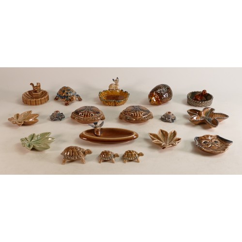 63 - A collection of Wade items including trinket pots, dishes, ashtray, and pin dishes. These items form... 