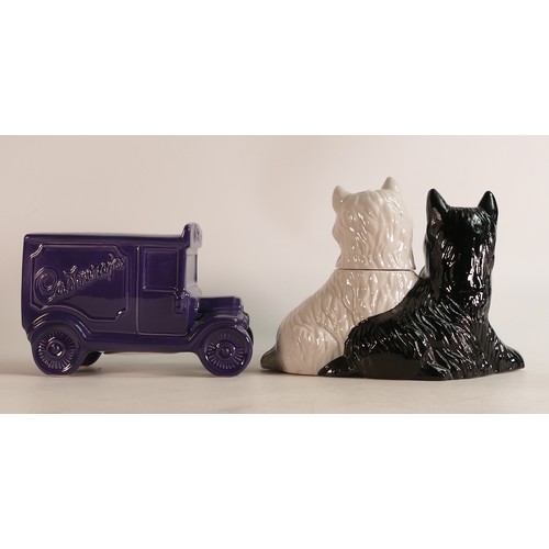 66 - Wade black & white dogs Whisky decanter together with a Cadbury Advertising money bank. These items ... 