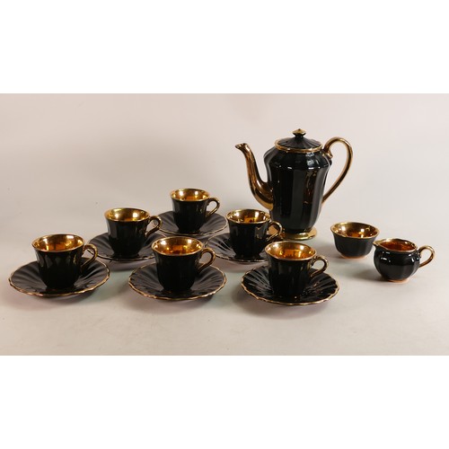 74 - A 15 Piece Wade coffee set in black with gold painted interior. These items form part the collection... 