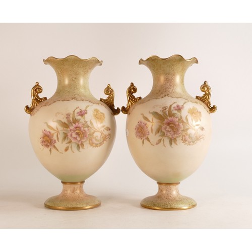 125 - A pair of Carlton ware Wiltshaw & Robinson Ivory Blush ware twin handled ruffle flared vases in the ... 