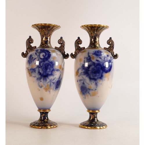 126 - A pair of Carlton ware Wiltshaw & Robinson Flow Blue twin handled vases in the Carnation pattern. Gi... 