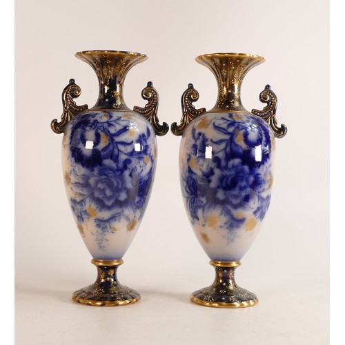 126 - A pair of Carlton ware Wiltshaw & Robinson Flow Blue twin handled vases in the Carnation pattern. Gi... 