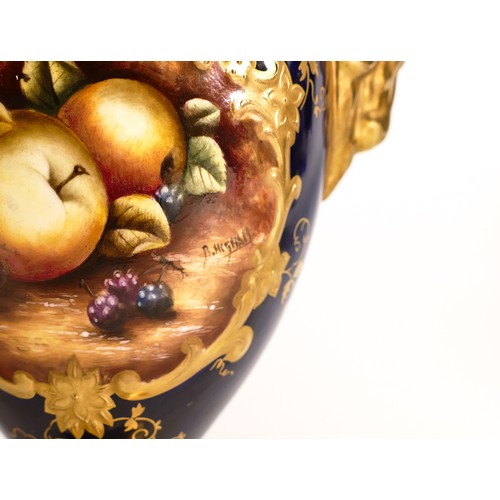 167 - Coalport two handled gilded vase & cover, hand painted with fruit on blue ground by B Higham, h.25cm... 