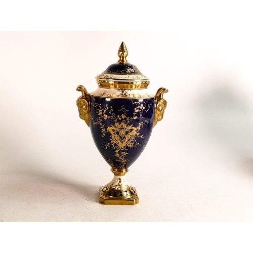 167 - Coalport two handled gilded vase & cover, hand painted with fruit on blue ground by B Higham, h.25cm... 