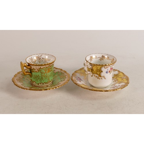 221 - Two Coalport cups & saucers, one yellow and gilt with floral border the other green and gilt.(4)