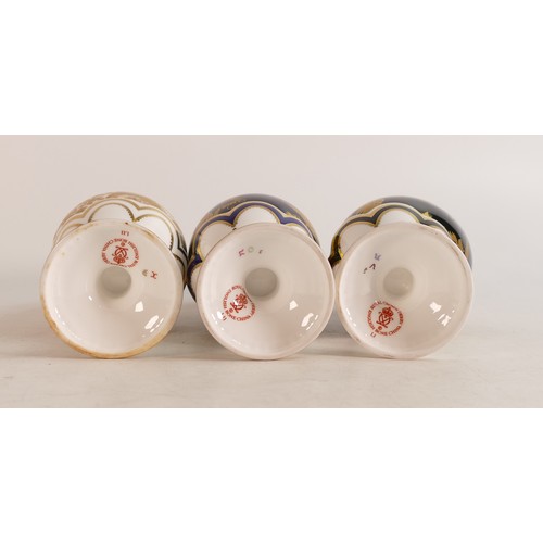 323 - Set of three Royal Crown Derby Aves Faberge Eggs and stands, limited edition 60/500 in white, cobalt... 