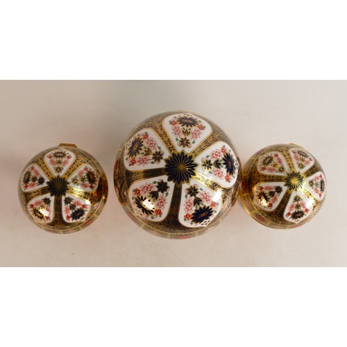 340 - A set of three Royal Crown Derby paperweights, comprising Millennium Globe Clock, Millennium Globe T... 