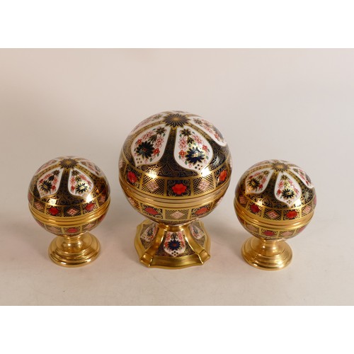 340 - A set of three Royal Crown Derby paperweights, comprising Millennium Globe Clock, Millennium Globe T... 