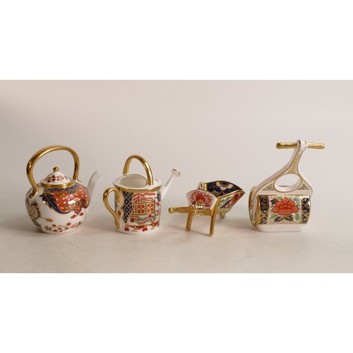 362 - A Royal Crown Derby Imari miniature model garden roller together with Watering Can, Wheelbarrow and ... 