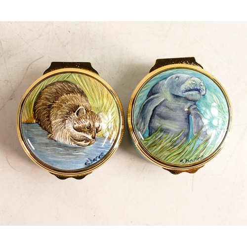 417 - Elliot Hall enamelled round lidded boxes in the Manatee and Raccoon designs. Limited edition 30/75. ... 