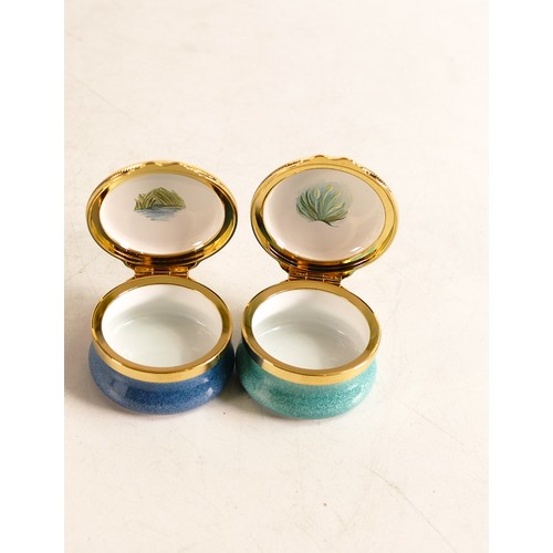 417 - Elliot Hall enamelled round lidded boxes in the Manatee and Raccoon designs. Limited edition 30/75. ... 